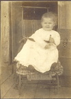 Baby on Porch in Push Chair Cropped 10001